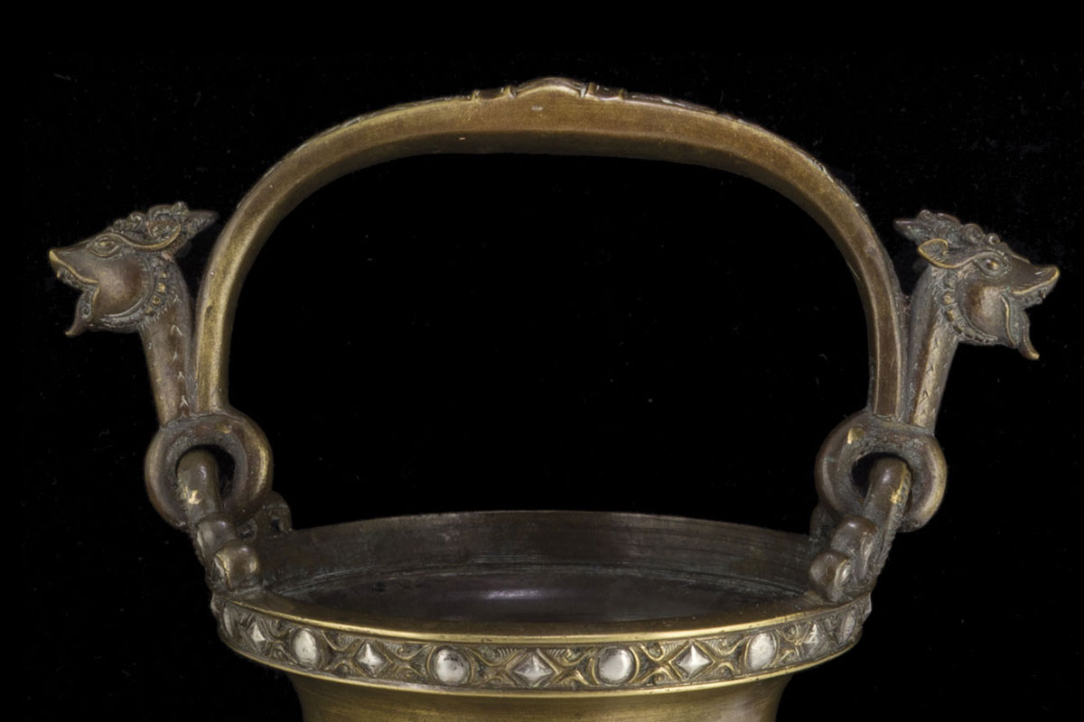 A Sri Lankan silver inlaid brass water temple jar