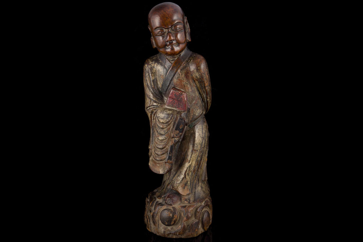 A rare Korean buddhistic hardwood lacquered figure of a monk, Choson period